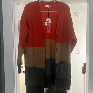 Button front cardigan with pockets. Never worn.